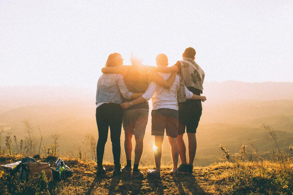 People looking into a sunset