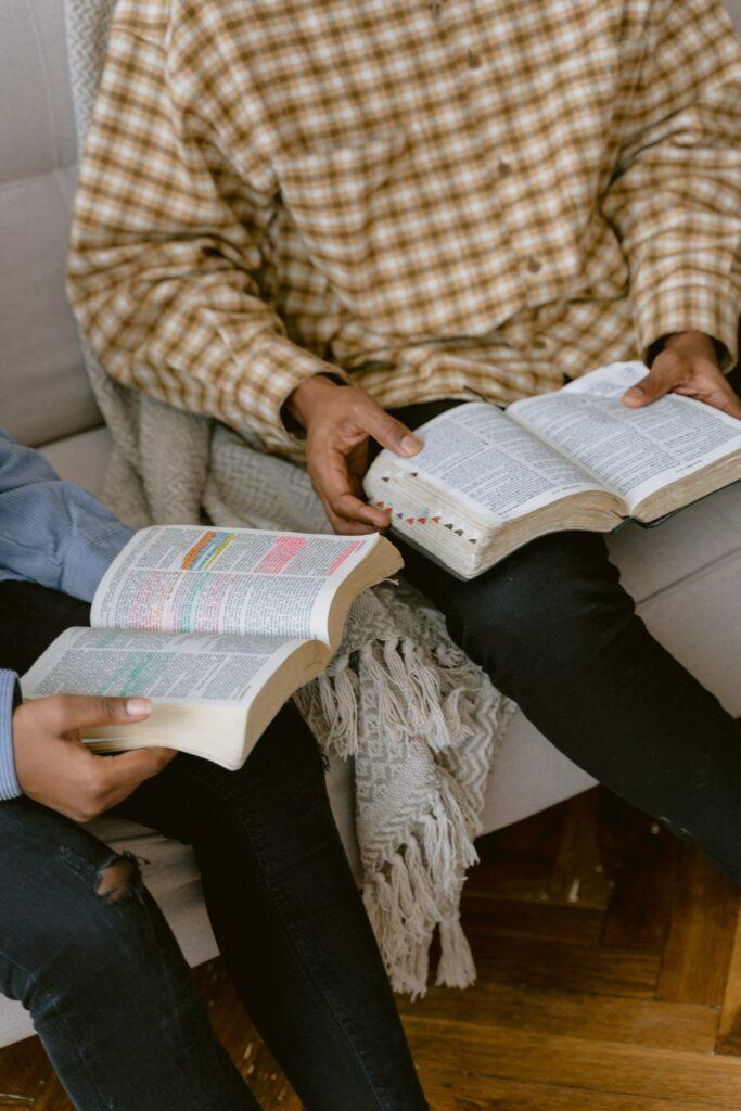 Man and kid reading Bible
